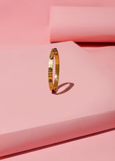 Gold Bangle with Stone Accents